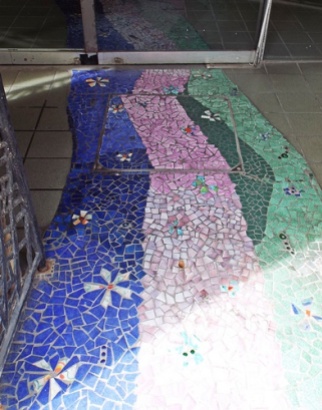 Mosaic tiled floor at the entrances to an event ticket office